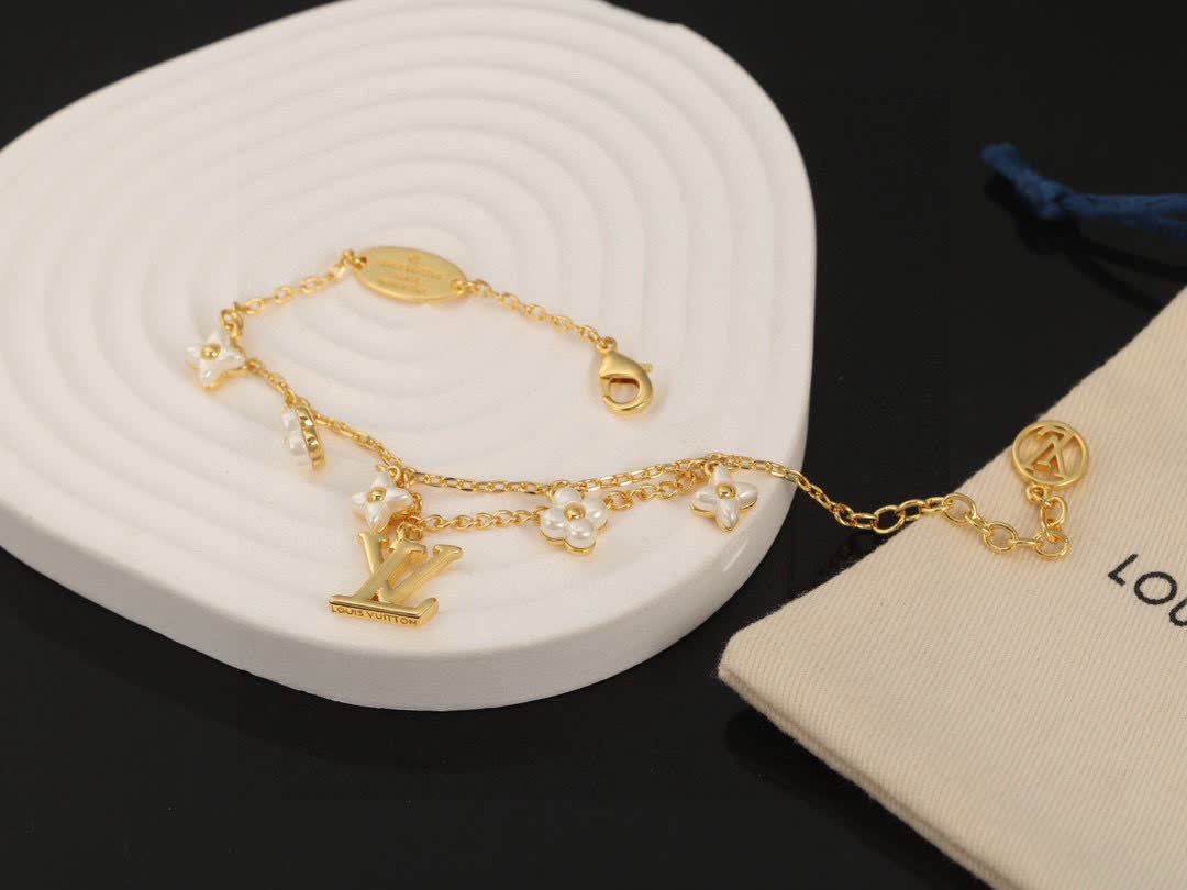 Louis Vuitton Gold Tone Bracelet with Pearls and Logo